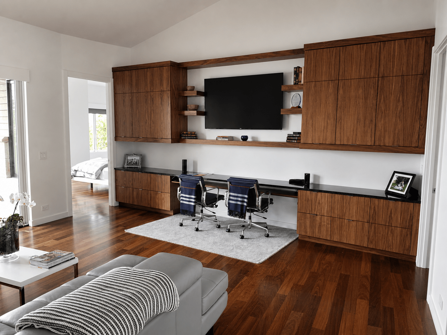Custom home office with an integrated display and discreet audio