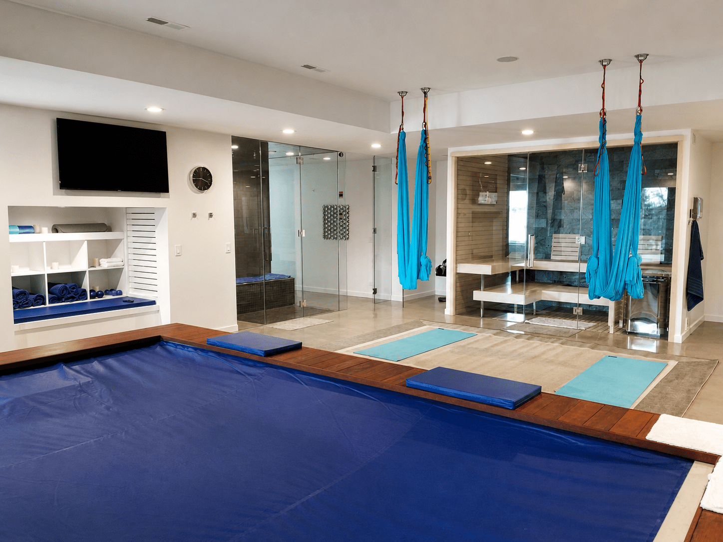 Home wellness room with an integrated display and ceiling speakers