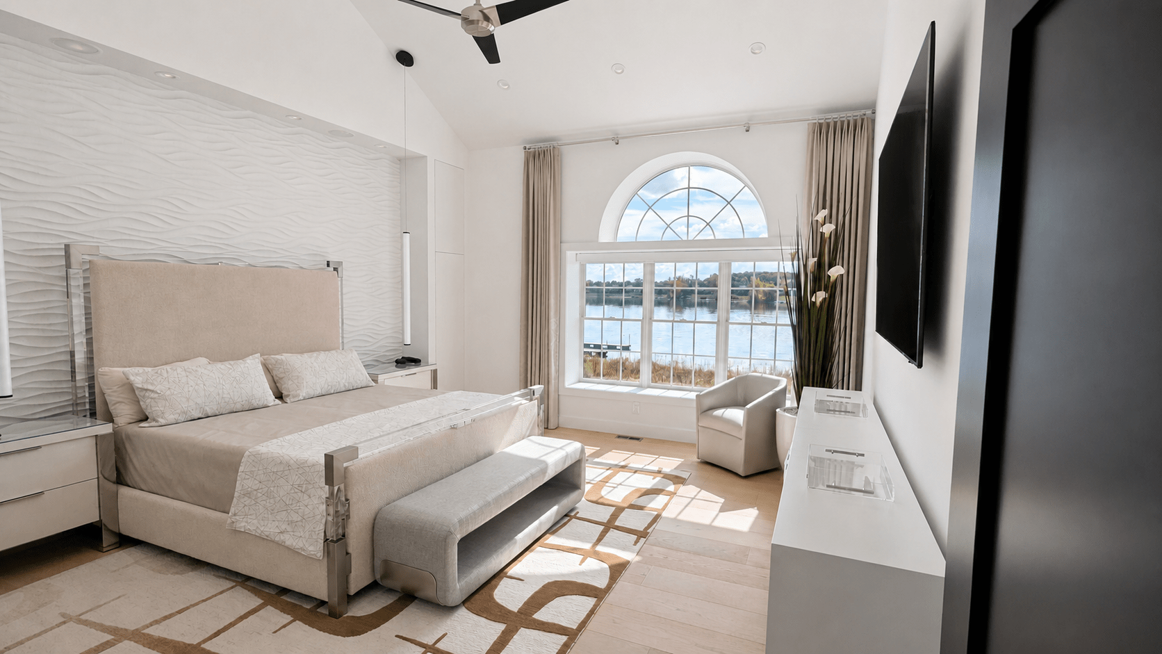 Novi bedroom with a wall-mounted display and integrated ceiling audio