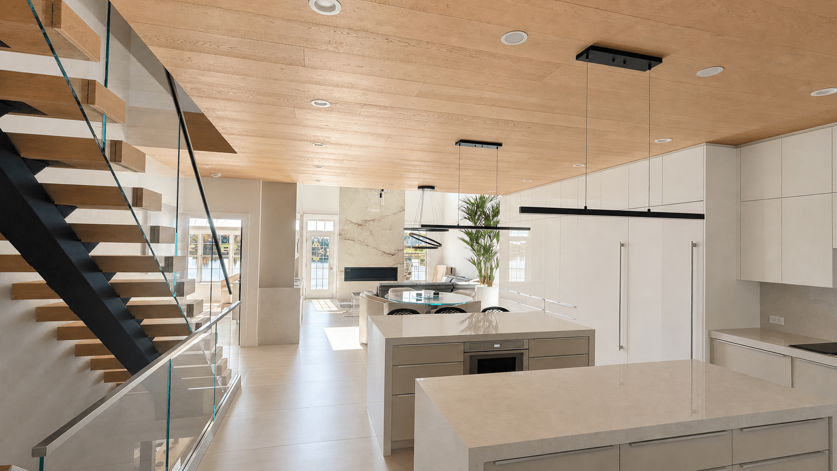 Open contemporary kitchen with architectural ceiling speakers in a Novi smart home
